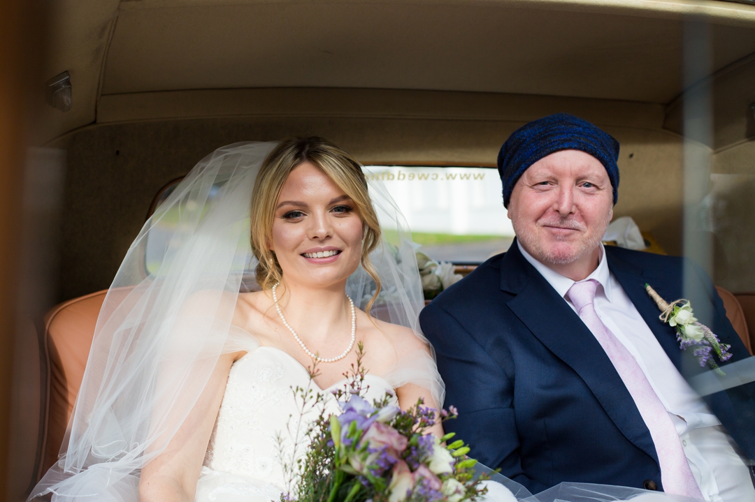 bride in wedding car at henley business school