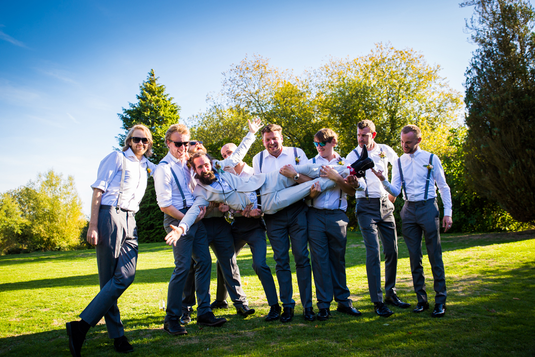 groom and groomsmen fun group wedding photo